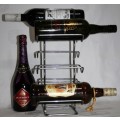 Here is a great, vintage, 5 bottle wine rack made out of Stainless steel. Stunning