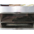 A LARGE INDUSTRIAL OVEN - WORKING WITH GAS SWITCHES ELECTRICAL PERFECT FOR PIZZA