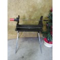 A FANTASTIC HIGH QUALITY FOLD UP BRAAI WITH A LITTLE ROTISSERIE