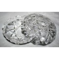 Here is a small, beautiful, round cut glass trinket dish with an unusual saw toothed edge on both