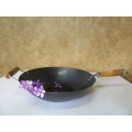 Large vintage steel wok with wooden handle. This is a very large and heavy duty wok.