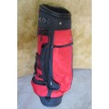A FANTASTIC RED AND BLACK TOP FLIGHT GOLF BAG IN GOOD CONDITION