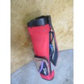 A FANTASTIC RED AND BLACK TOP FEITLEIST GOLF BAG IN GOOD CONDITION