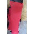 A FANTASTIC RED AND BLACK TOP FEITLEIST GOLF BAG IN GOOD CONDITION
