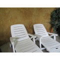 TWO FANTASTIC WHITE FOLD UP LOUNGERS ON WHEELS PERFECT FOR THIS SUMMER WEATHER