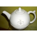 A STYLISH OFF WHITE TEA POT WITH STUNNING DESIGN THAT WILL MAKE A STATEMENT