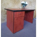 A VERY PRACTICAL AND USEABLE CHERRY WOOD FINISHED DESK - PAINT IT IN YOUR FAVORITE COLOR
