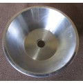 A ROUND STAINLESS STEEL BASIN