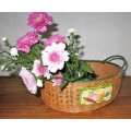 A Gorgeous Country style Oval Wicker Basket with Handles and Ceramic decorative plaque