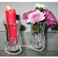 Two crystal flower vases it has beautiful design around the entire vase. BID PER EACH
