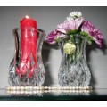 Two crystal flower vases it has beautiful design around the entire vase. BID PER EACH