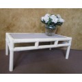 A LOVLEY CANE COFFEE TABLE FINISHED IN ROYAL IVORY CHALK PAINT WITH A TILED TOP