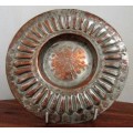 This is a fabulous retro copper plate with a stunning hammered motif .