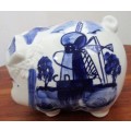 A marvelous Vintage and cute - blue delft, hand painted pig with slot on top for bank.