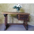 A MARVELOUS VINTAGE SOLLID WOOD DESK WITH STUNNING DETAIL FEATURES TWO DRAWERS