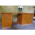 A FANTASTIC LONG DESK WITH AMPLE SPACE THREE DEEP DRAWERS WITH 2 DOORS AND SHELVING