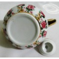 A VERYY PRETTY LITTLE PORCELAIN TEA POT BEAUTIFULLY DECORATED WITH STUNNING COLORS
