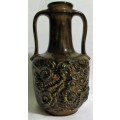 A MARVELOUS LARGE ORNATE CERAMIC/POTERY VASE FINISHED IN A STUNNING DESIGN