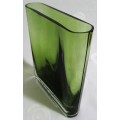 A heavy decorative flower Vase. It's made of an emerald green glass in a modern rectangular shape