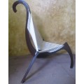 A EXQUISITE DESIGNER CHAIR WITH A DARK WOOD AND ROPE DESIGN ABSOLUTELY STUNNING