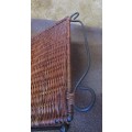 A LOVLEY WEAVED CANE AND METAL FOLD UP MAGAZINE RACK
