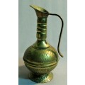 Here is a beautiful vintage oriental brass pitcher. Embossed and colored with beautiful folk ornamen