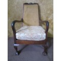 A GORGEOUS SOLID IMBUIA BOW BACKED BALL & CLAW ARM CHAIR WITH A RARE WEAVED RATTAN BACK