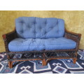 A GORGEOUS TWO SEATER CUSHIONED COUCH WILL LOOK STUNNING IN A SUN ROOM & PATIO OR IN THE GARDEN