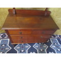 A magnificent Antique 4 drawer dressing table with a large bevelled mirror - on original casters
