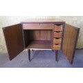A MARVELOUS VINTAGE TWO DOOR CABINET WITH FOUR DRAWERS - PERFECT FOR ALL YOUR CRAFT APPLIANCES