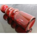 Very unusual red glass candle  holder or vase - pretty striking and different.