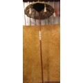 A BEAUTIFUL LONG INDIAN UMBRELLA DECORATED WITH BELS - TUSSLES EX