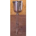 A STYLISH TALL CHAMPAGNE/WINE COOLER ON A STAND