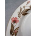 AN EXQUISITE VINTAGE PORCELAIN PLATE BEAUTIFULLY DESIGNED WITH A FLORAL PATERN -