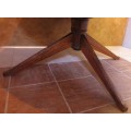 A VERY LARGE OVAL TO ROUND EXTENDABLE TABLE WITH BEAUTIFUL LEGS