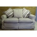 A VERY COMFORTABLE 2 SEATER COUCH IN GOOD CONDITTION