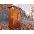 Four-door Mahogany cupboard with beautiful crown molding on top
