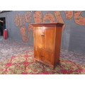 Four-door Mahogany cupboard with beautiful crown molding on top