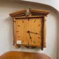 Solid yellow wood battery-operated wall clock