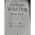 IN SEARCH OF THE AFRICAN WILD DOG ROGER and PAT DE LA HARPE Signed by Both Authors