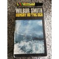 WILBUR SMITH HUNGRY AS THE SEA HEINEMAN 1978 Reprint  Edition