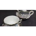 Miniature teapot and teacup
