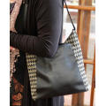 TUMI LEATHER AND HOUNDSTOOTH WOOL BUCKET HANDBAG. QUITE RARE! DUSTCOVER.