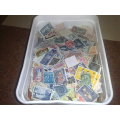 JUST RECEIVED=ICE CREAM TUB ALMOST FILLED WITH THOUSANDS OF STAMPS-INTERESTING!!
