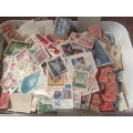 ICE CREAM TUB-FILLED WITH MANY THOUSANDS OF STAMPS-MANY OLDIES,INTERESTING LOT