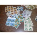 RHODESIA-CLEARANCE LOT-100 BLOCKS OF 4 AND 2-3 HUNDRED LOOSE STAMPS-ALL FINE UM