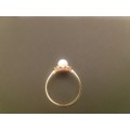 VINTAGE 9 KARAT GOLD RING WITH PEARL & SMALL RED STONES IN SURROUNDS-TOTAL WEIGHT 1.23 GRAMS