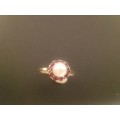 VINTAGE 9 KARAT GOLD RING WITH PEARL & SMALL RED STONES IN SURROUNDS-TOTAL WEIGHT 1.23 GRAMS
