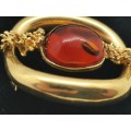 Vintage gold brooch set with amber