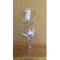 Large stemmed glass vase.